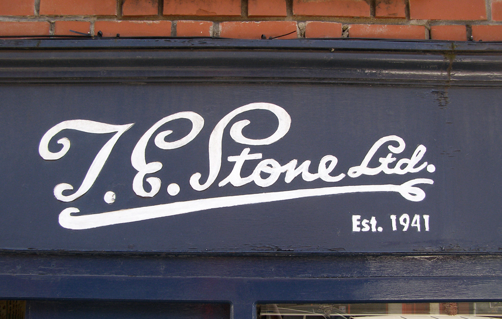 T.E. Stone Ltd. hand-painted sign.
