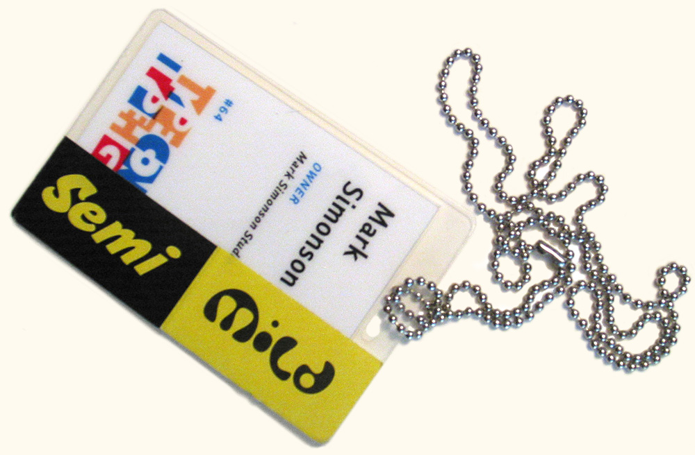 Photo of a TypeCon2003 name tag adorned with FontShop stickers